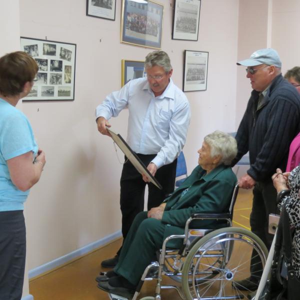 GM Chris van der Werff looks for a photo of Pat in the Canteen