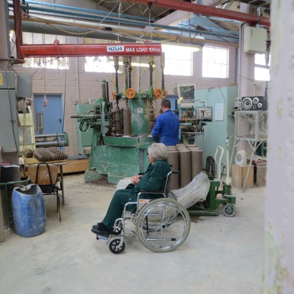 Viewing work on the "Carousel" (Automated Insulator Machine)