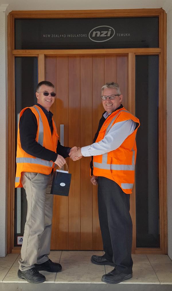 Peter Quested receives a gold watch from Chris van der Werff, July 2017